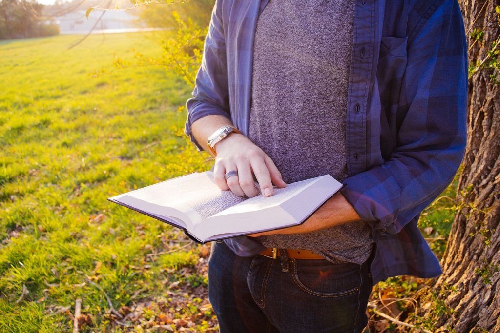 bible1-web Man holding a Bible